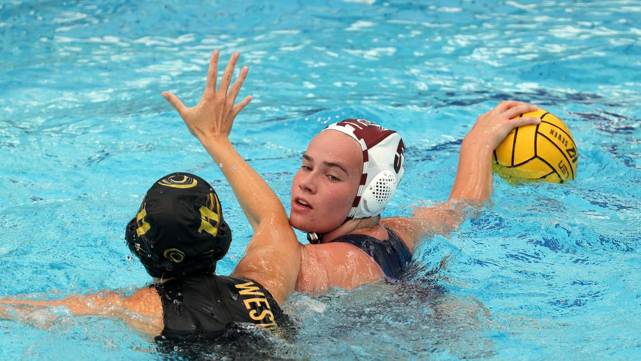 <p>Claudia Czerniawski of Queensland Maroons under pressure from Allegra Childs of Western Australia.</p>