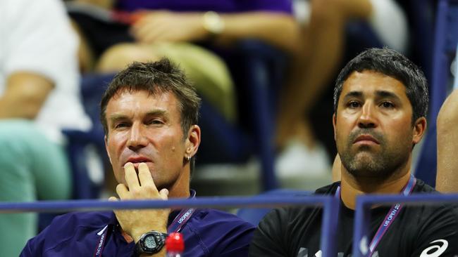 Pat Cash watches on.