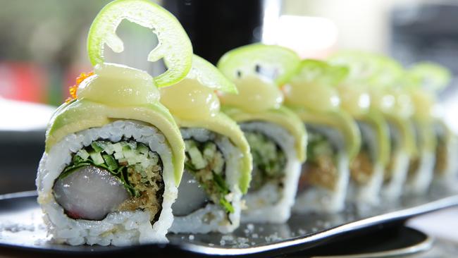 Kingfish in Mexico roll — kingfish, coriander, cucumber, sabi kewpie, crunchies, inside and avocado, pineapple candy puree, masago, jalapeño, on the outside.