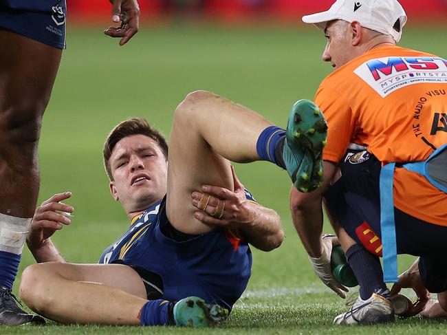 SYDNEY, AUSTRALIA - SEPTEMBER 16:  Tom Opacic of the Eels is attended to by the team trainer after an injury during the NRL Semi Final match between the Parramatta Eels and the Canberra Raiders at CommBank Stadium on September 16, 2022 in Sydney, Australia. (Photo by Mark Kolbe/Getty Images)