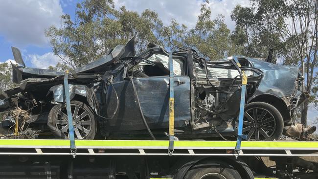 Police said the blue 2010 Holden Commodore ran off the highway and crashed into trees before overturning.