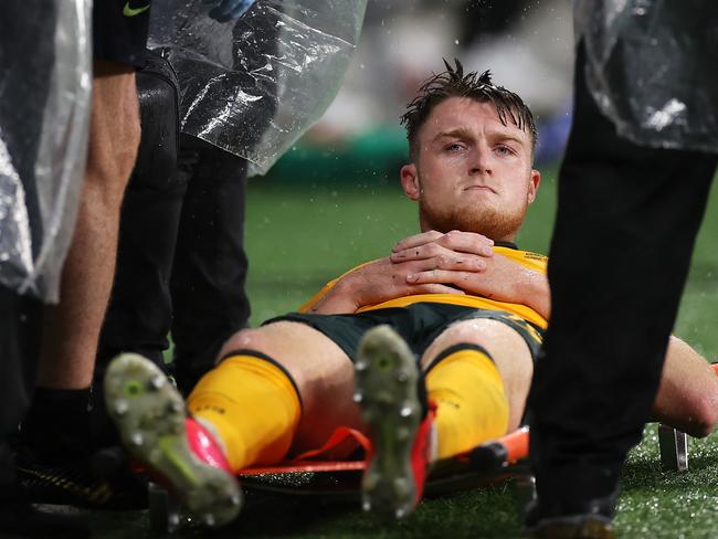 SYDNEY, AUSTRALIA - NOVEMBER 11: Harry Souttar of Australia   looks dejected after being stretchered from the field during the FIFA World Cup AFC Asian Qualifier match between the Australia Socceroos and Saudi Arabia at CommBank Stadium on November 11, 2021 in Sydney, Australia. (Photo by Mark Kolbe/Getty Images)