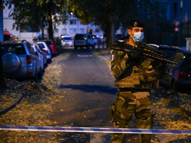 A French soldier stands behind a cordon near the church in Lyon where a priest was shot. Picture: AFP