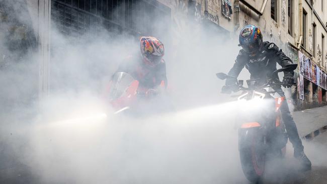 MotoGP star Jack Miller (left) decided to do a burnout in a city laneway. Picture: Jake Nowakowski