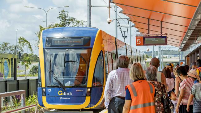 Opening morning of the Stage 2 of the Gold Coast light rail. The crowds wait as the light rail tram enters the station at Helensvale. Picture: Jerad Williams