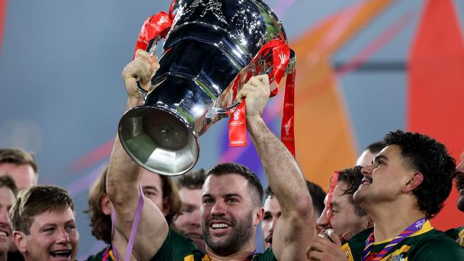 James Tedesco of Australia lifts the Rugby League World Cup trophy