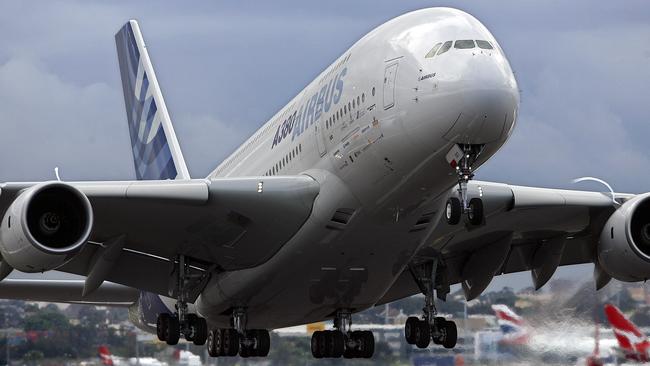 (FILES) This file photo taken on June 7, 2007 shows an Airbus A380 taking off on a demonstration flight from Sydney International Airport. - European aerospace giant Airbus said on February 14, 2019 it would end production of the A380 superjumbo, the double-decker jet which earned plaudits from passengers but failed to win over enough airlines to justify its massive costs. (Photo by TORSTEN BLACKWOOD / AFP)