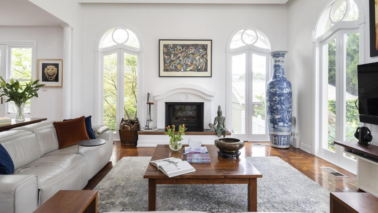 The ornate windows and doors give much natural light to the living area.