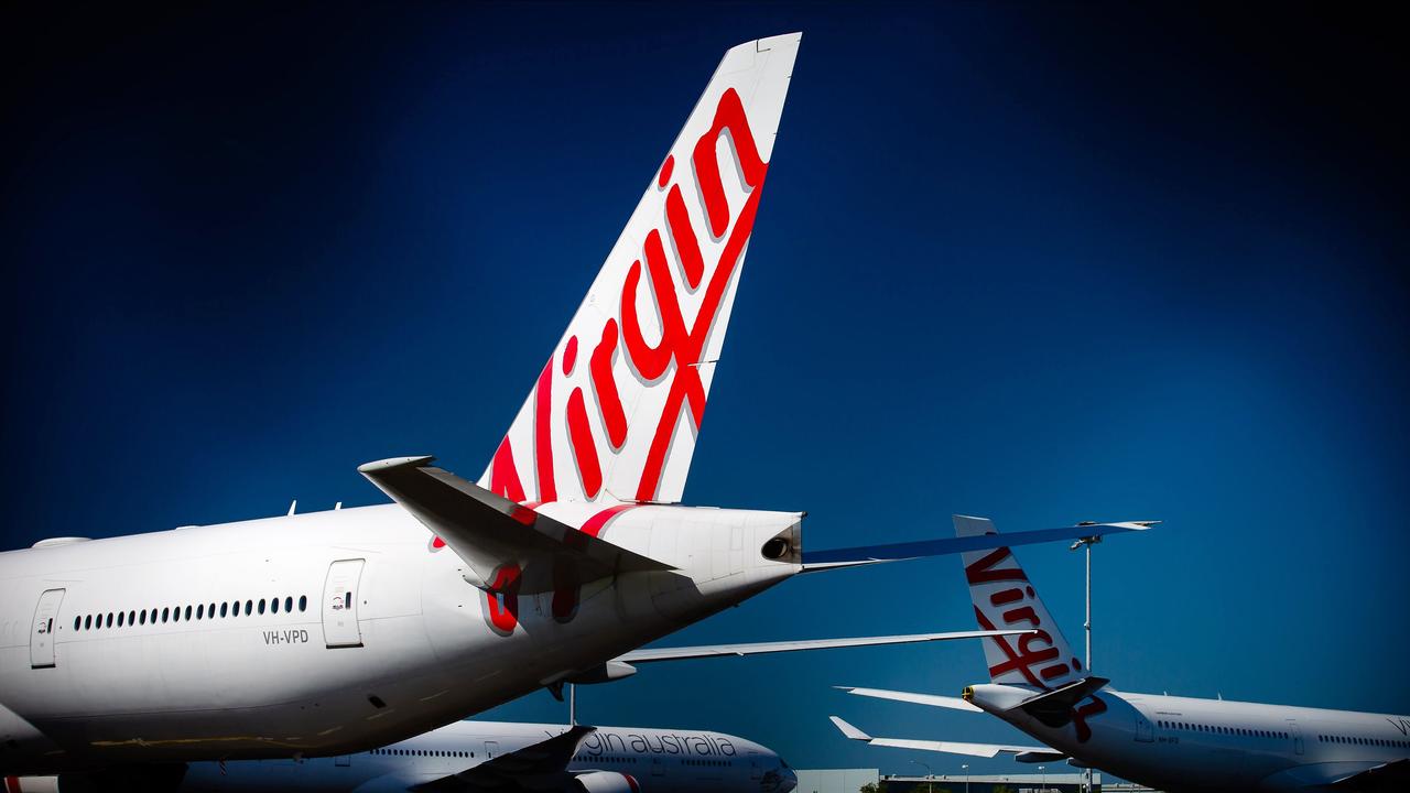 Virgin Australia aircraft parked on the tarmac at Brisbane Airport. Picture: Patrick Hamilton/AFP