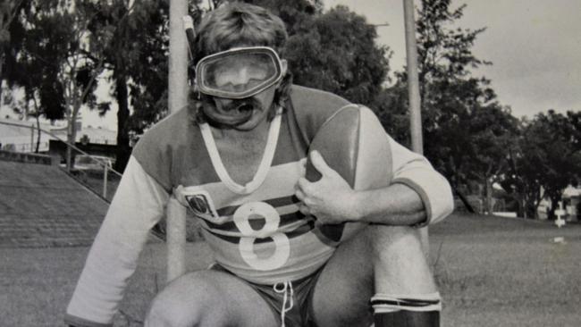 Peter Gardiner in the guise of the QT sports editor, with snorkel and flippers, ready to play local footy on a very wet track in Ipswich.