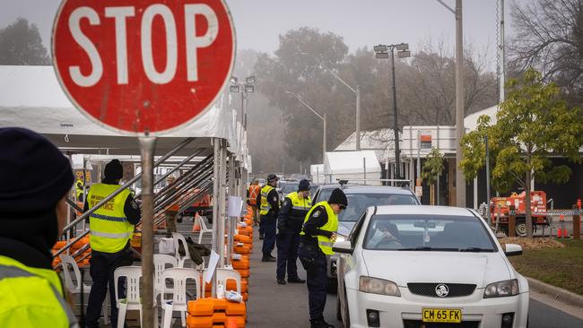 Travellers are stopped at the border crossing check point in Albury. Picture: NCA NewsWire / Simon Dallinger