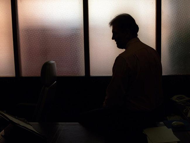 Generic image. Silhouette of a man (parent of) a sex abuse victim in an office. wrongly accused of touching young girl. Child sexual abuse. sex crime incest paedophilia.