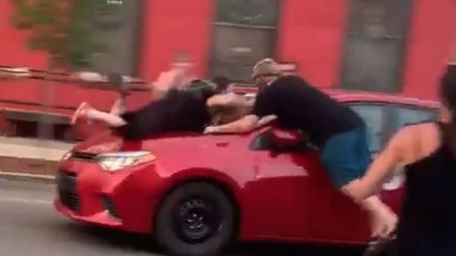 A protester is hit by a car during a protest in Indiana. Picture: Twitter