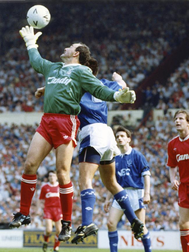 Ex Liverpool goalkeeper Bruce Grobbelaar stretches to take the ball away from Everton striker Graeme Sharp during the FA Cup Final at Wembley Stadium in 1989. Picture: AP Photo/White, File