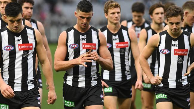 Collingwood players leave the ground after another disappointing loss. Picture: AAP Images