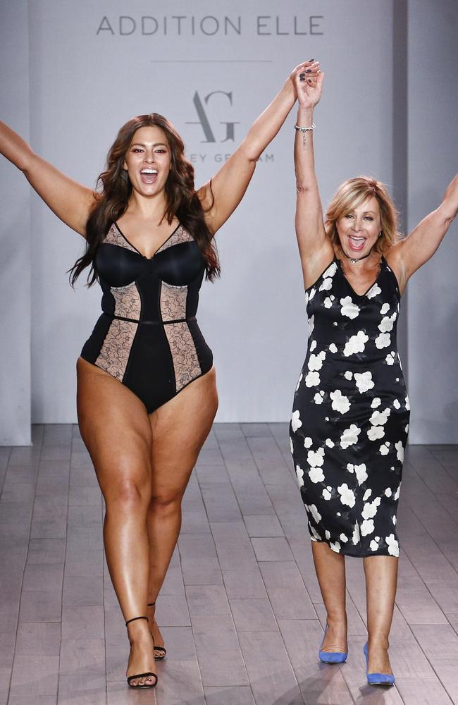 Ashley Graham (L) appears on the runway for Addition Elle.