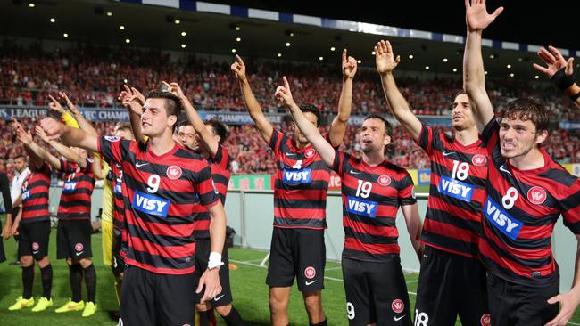 Wanderer's Tomi Juric (l) and team mates celebrate with fans. (Gregg Porteous)