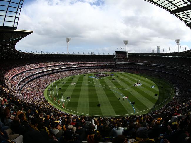 The massive crowd, the first 100,000-plus in many years, soak up The Killers entertainment. The Killers killed it ahead of the Grand Final. Picture: Robert Cianflone/AFL Media/Getty Images