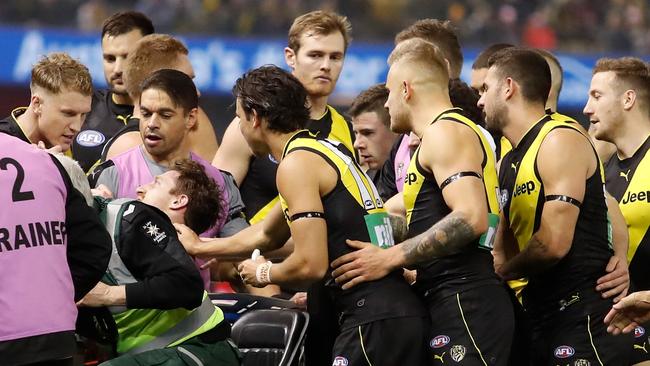 Richmond players console teammate Reece Conca.