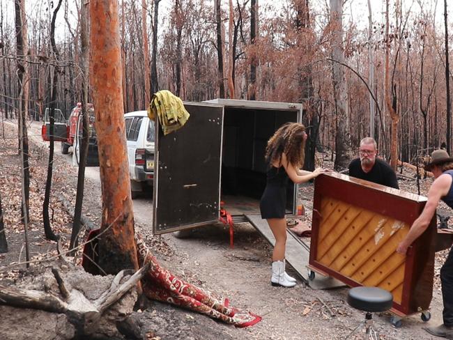 Grace and Hugh get a hand from Nymboida fire captain Paul.