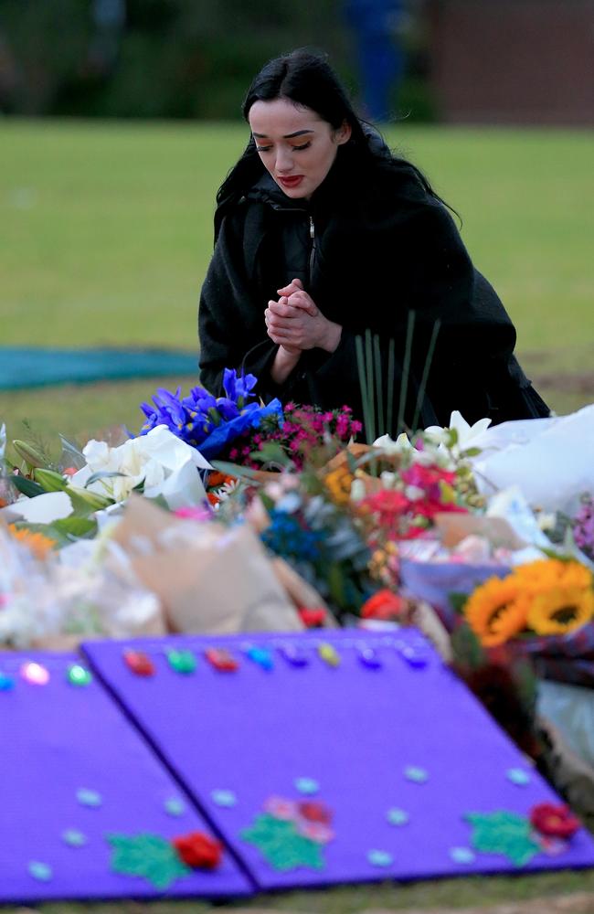 A mourner pays her respects to Eurydice Dixon. Picture: Mark Stewart