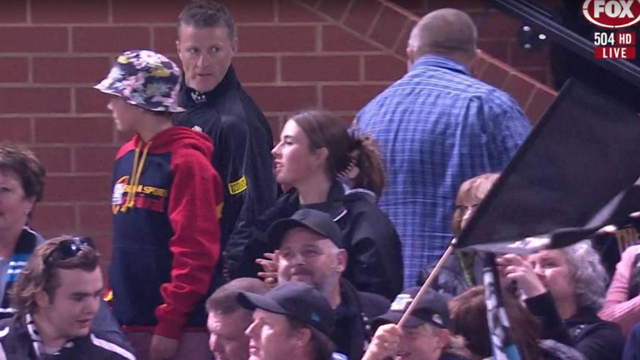 A fan speaks with Richmond coach Damien Hardwick after the game.