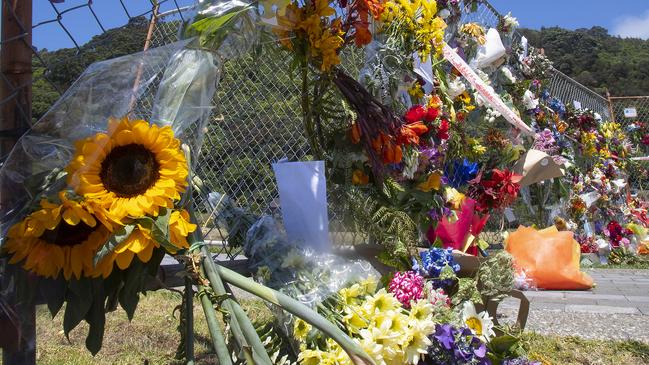 Flower are seen on the fence near the Whakatane Wharf on December 13, in Whakatane, New Zealand. Six bodies have been successfully recovered from White Island. Picture: Getty