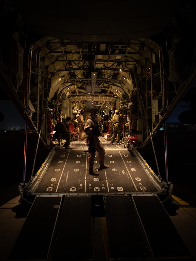 Troops guard the plane. Picture: ADF