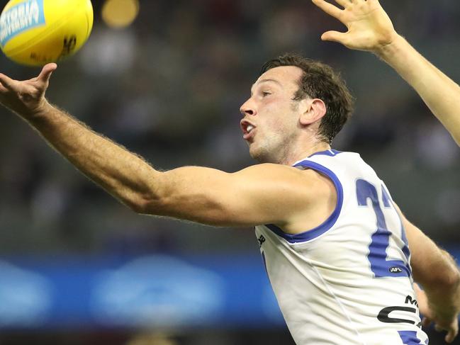 Todd Goldstein taps the ball away for North Melbourne  during the Round 14 AFL match between Western Bulldogs and North Melbourne at Etihad Stadium, Melbourne, Saturday, June 23, 2018. (AAP Image/ David Crosling) NO ARCHIVING, EDITORIAL USE ONLY