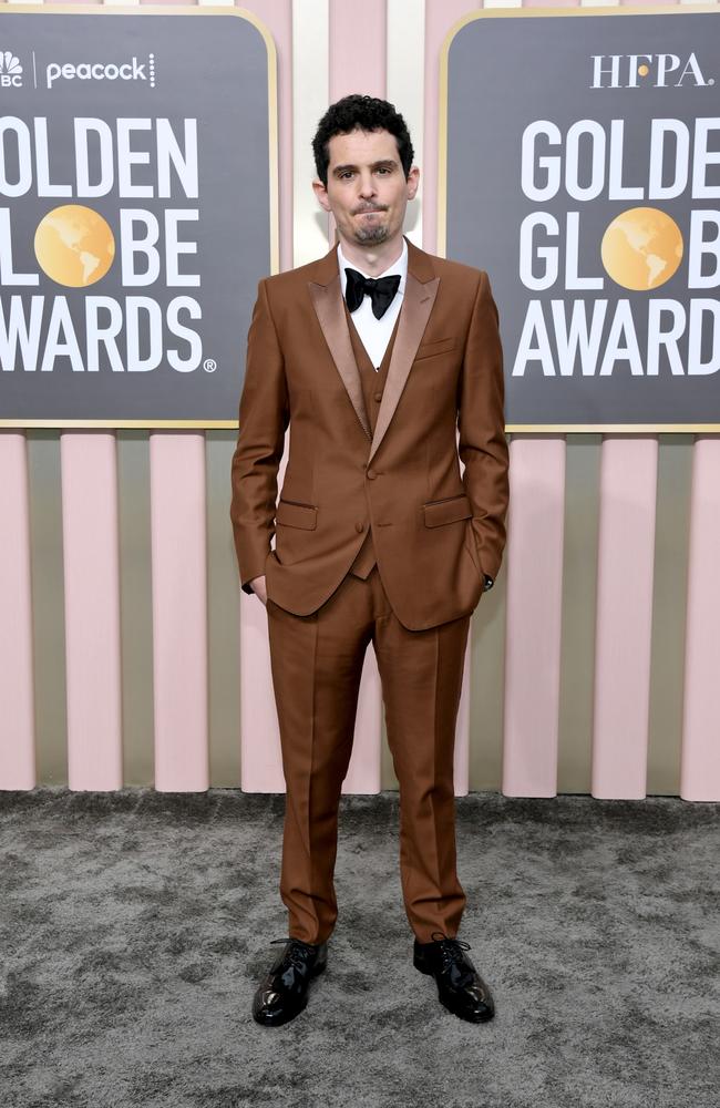 Damien Chazelle looks dapper in a brown suit and bowtie. Picture: Getty Images