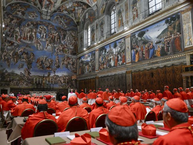 Cardinals sit inside the Sistine Chapel at the Vatican at the start of the conclave. Picture: AP Photo
