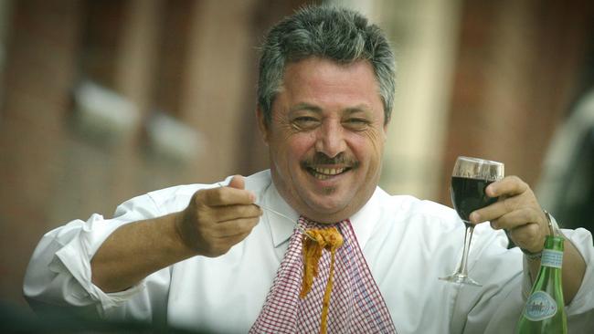 George Belperio tucks into a plate of fettuccine.