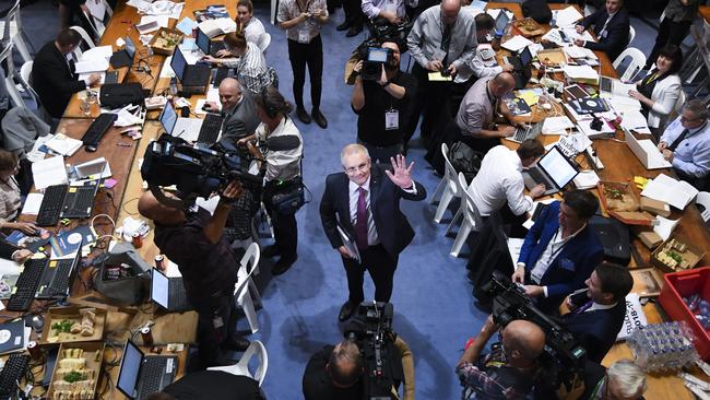 Australian Treasurer Scott Morrison waves as he departs after a tour of the 2018 Budget Lockup at Parliament House in Canberra on Tuesday.