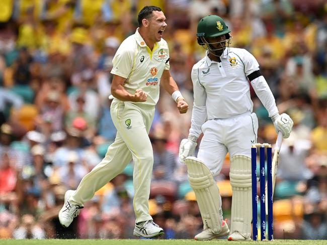 *APAC Sports Pictures of the Week - 2022, December 19* - BRISBANE, AUSTRALIA - DECEMBER 17: Scott Boland of Australia celebrates taking the wicket of Khaya Zondo of South Africa for a duck during day one of the First Test match between Australia and South Africa at The Gabba on December 17, 2022 in Brisbane, Australia. (Photo by Albert Perez/Getty Images)