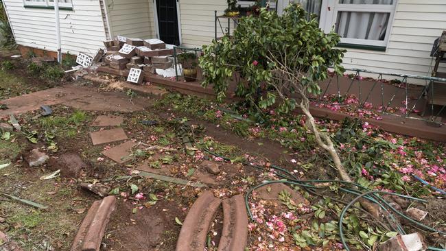 The car caused considerable damage to the front yard of the rental property. Picture: Kevin Farmer