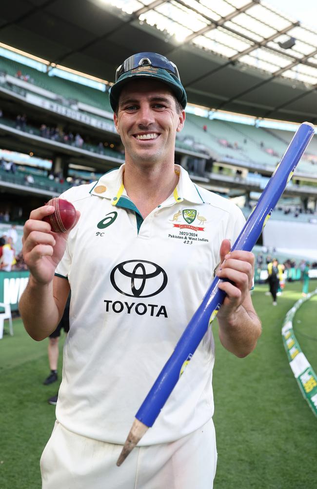 Australian captain Pat Cummins poses with a souvineered stump and the match ball after a starring performance in the 2023 Boxing Day Test match against Pakistan. Picture: Robert Cianflone/Getty Images