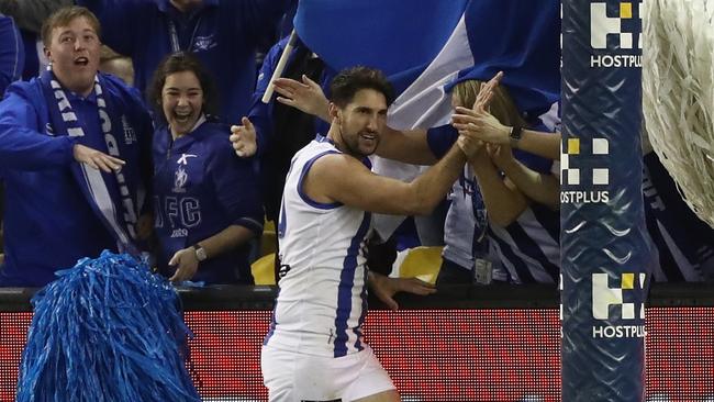 Jarrad Waite high-fives the cheersquad after a goal.