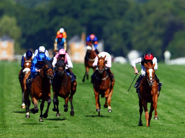 ASCOT, ENGLAND - JUNE 20: Ryan Moore riding Kyprios (r) breaks clear to win The Gold Cup on day three of Royal Ascot 2024 at Ascot Racecourse on June 20, 2024 in Ascot, England. (Photo by Bryn Lennon/Getty Images)