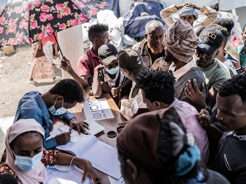 Workers register refugees after they crossed from Sudan to Ethiopia. Picture: Amanuel Sileshi/AFP