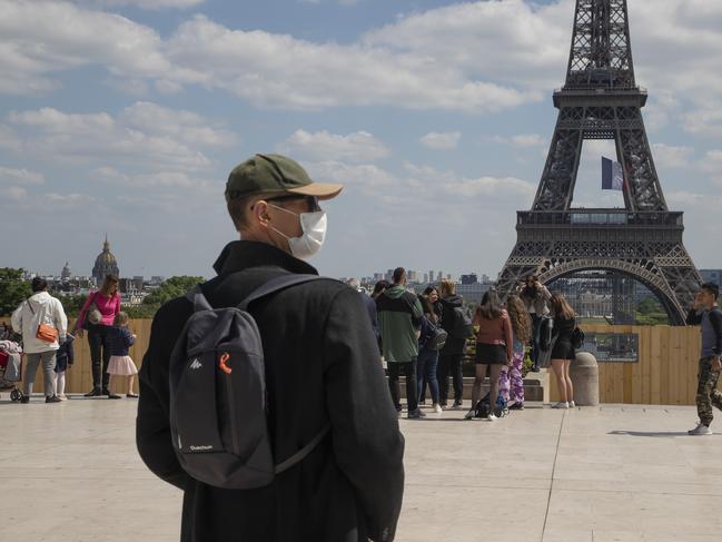 People gather at Trocadero Square next to the Eiffel Tower in Paris. Picture: AP