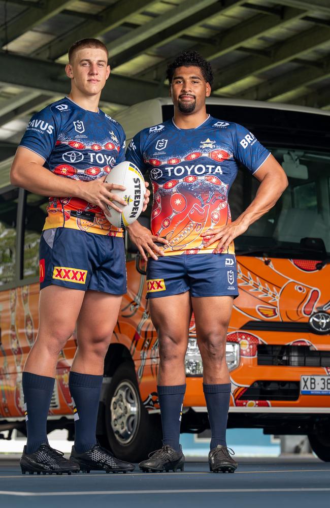 North Queensland Cowboys rugby league players Kaiden Lahrs and Jamal Shibasaki standing in front of a new ‘Nhinhinhi’-inspired Toyota Coaster. The 22-seat Coaster, donated by Toyota, provides daily transport for NRL Cowboys House boarding students. Picture: Supplied