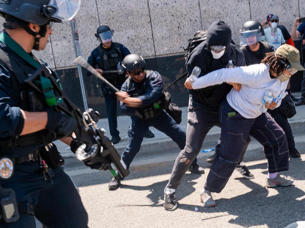 The National Guard, police and protesters stand off outside a downtown jail in Los Angeles. Picture: Getty Images via AFP