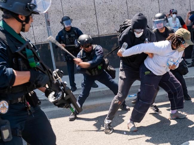 The National Guard, police and protesters stand off outside a downtown jail in Los Angeles. Picture: Getty Images via AFP