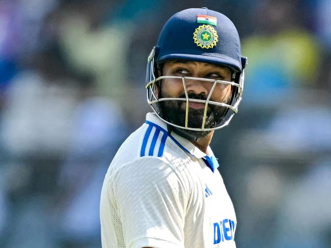 India's captain Rohit Sharma walks back to the pavilion after his dismissal during the third day of the third and final Test cricket match between India and New Zealand at the Wankhede Stadium in Mumbai on November 3, 2024. (Photo by INDRANIL MUKHERJEE / AFP) / -- IMAGE RESTRICTED TO EDITORIAL USE - STRICTLY NO COMMERCIAL USE --