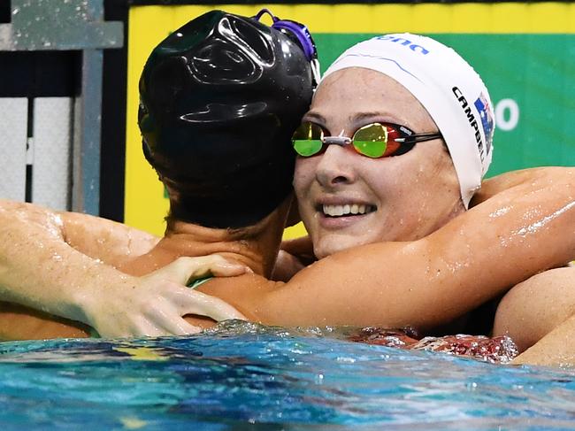 ADELAIDE, AUSTRALIA - JUNE 16:Emma McKeon hugs second place Cate Campbell after she won the Women's 100 metre Freestyle final  during the Australian National Olympic Swimming Trials at SA Aquatic & Leisure Centre on June 16, 2021 in Adelaide, Australia. (Photo by Mark Brake/Getty Images)