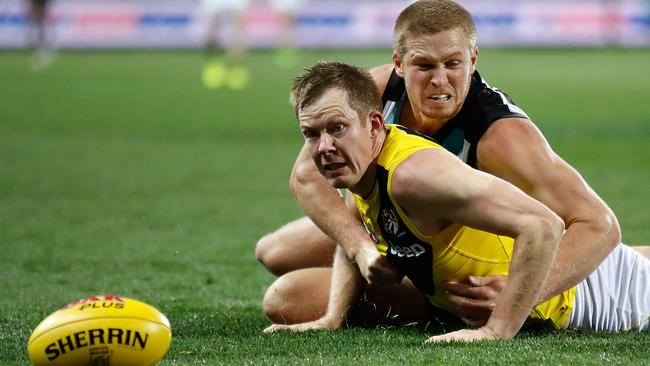 Port’s Tom Clurey tackles Richmond’s Jack Riewoldt last week. Picture: GETTY IMAGES