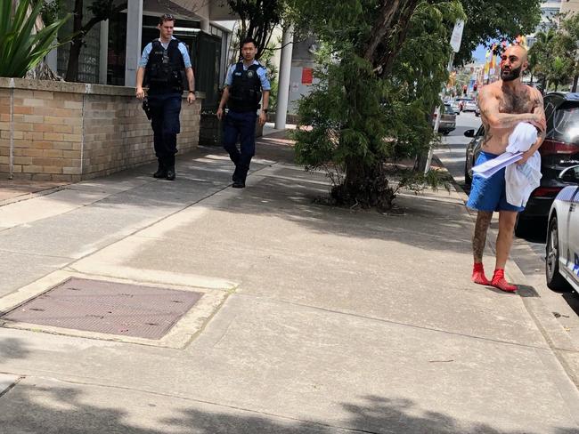 Ibrahim Cheik- Hussein (right) leaves Maroubra Police Station.