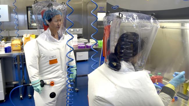 WUHAN, CHINA - FEBRUARY 23 2017: Virologist Shi Zheng-li, left, works with her colleague in the P4 lab of Wuhan Institute of Virology (WIV) in Wuhan in central China's Hubei province Thursday, Feb. 23, 2017.- PHOTOGRAPH BY Feature China / Barcroft Studios / Future Publishing (Photo credit should read Feature China/Barcroft Media via Getty Images)