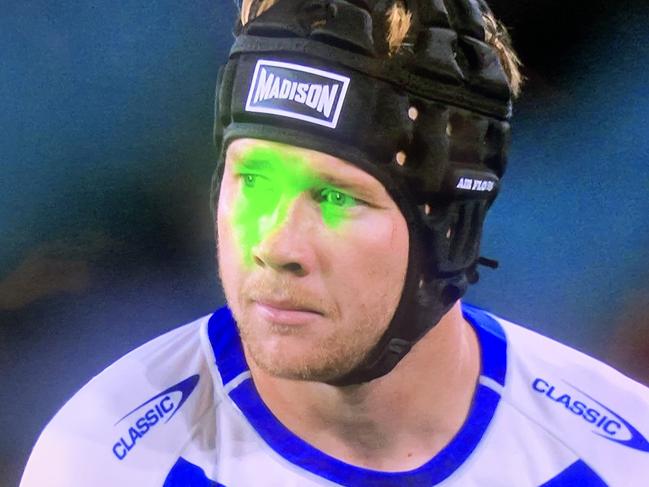 A fan has been ejected from Accor Stadium after allegedly point a laser at Matt Burton's face while lining up to take a conversion attempt.