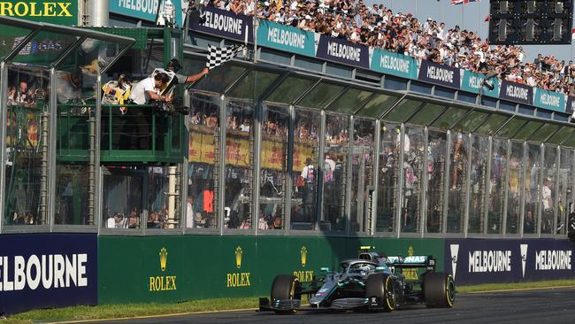 Finnish driver Valtteri Bottas of the Mercedes team crosses the line to win the F1 Grand Prix at Albert Park in 2019. Picture: James Ross